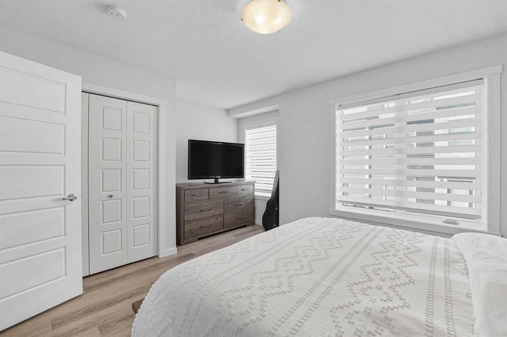 102-474 Seton Circle Se, Calgary, AB - Indoor Photo Showing Bedroom