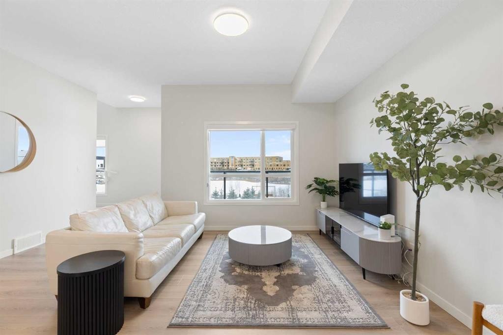 608-20295 Seton Way Se, Calgary, AB - Indoor Photo Showing Living Room