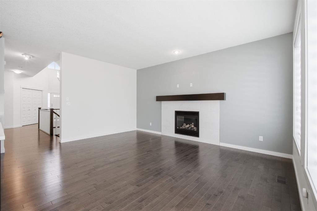 101 Evansborough Green Nw, Calgary, AB - Indoor Photo Showing Living Room With Fireplace