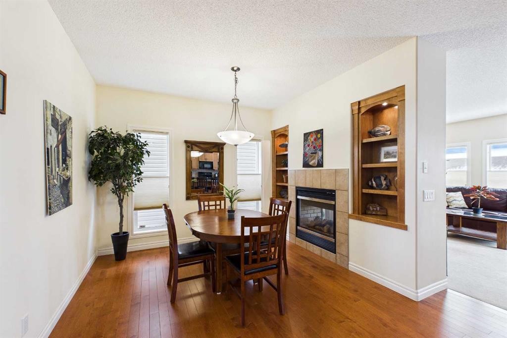 167 Evanston View Nw, Calgary, AB - Indoor Photo Showing Dining Room With Fireplace