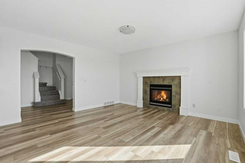 53 Saddlecrest Place Ne, Calgary, AB - Indoor Photo Showing Living Room With Fireplace