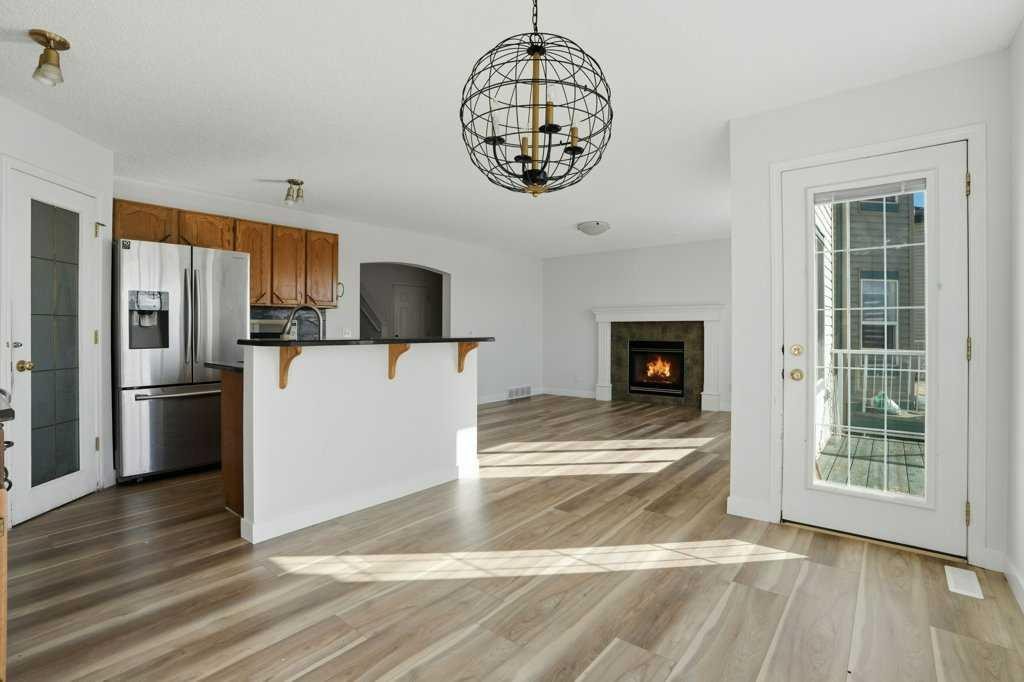 53 Saddlecrest Place Ne, Calgary, AB - Indoor Photo Showing Kitchen With Fireplace