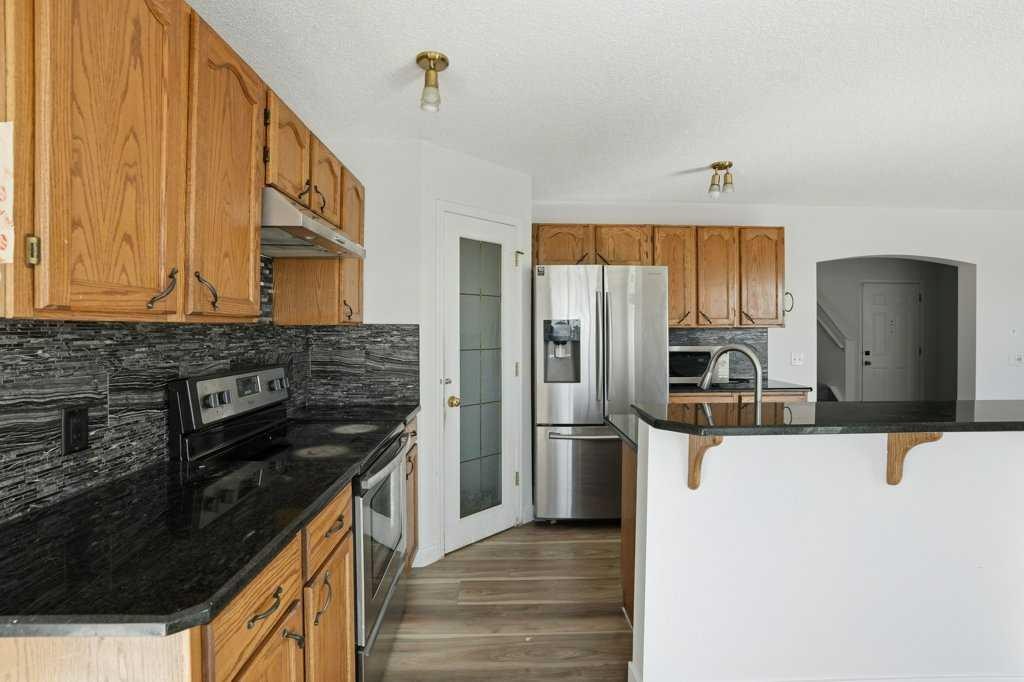53 Saddlecrest Place Ne, Calgary, AB - Indoor Photo Showing Kitchen With Stainless Steel Kitchen With Upgraded Kitchen