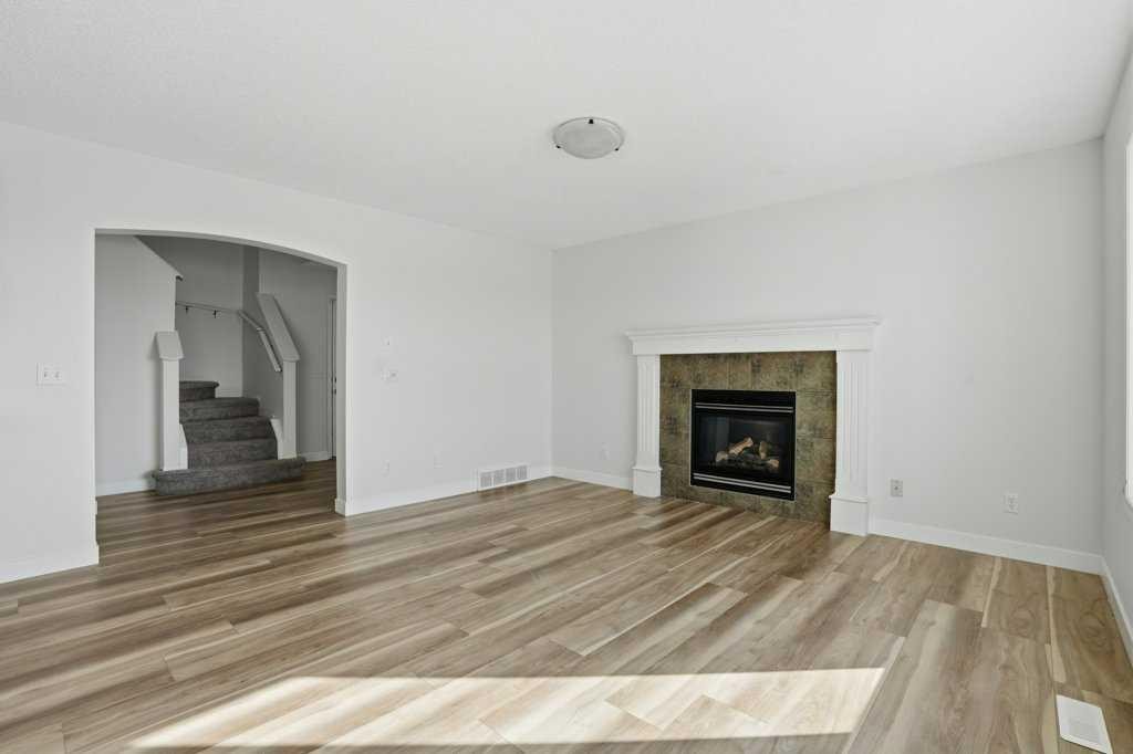 53 Saddlecrest Place Ne, Calgary, AB - Indoor Photo Showing Living Room With Fireplace
