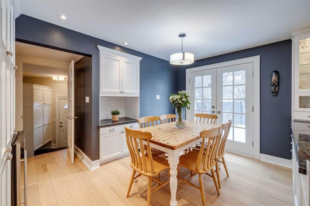 3920 Crestview Road Sw, Calgary, AB - Indoor Photo Showing Dining Room With Fireplace