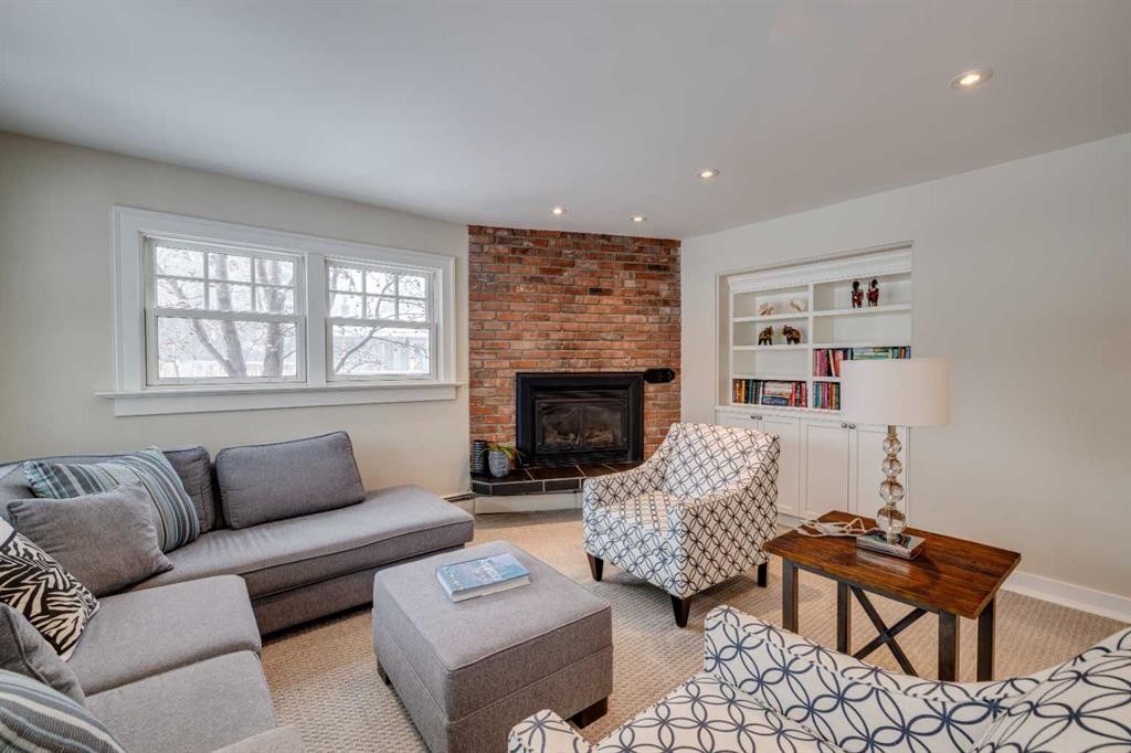 3920 Crestview Road Sw, Calgary, AB - Indoor Photo Showing Living Room With Fireplace