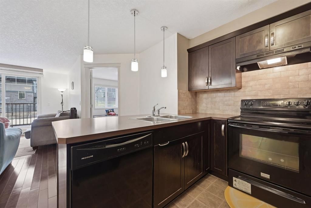2119-175 Panatella Hill Nw, Calgary, AB - Indoor Photo Showing Kitchen With Double Sink