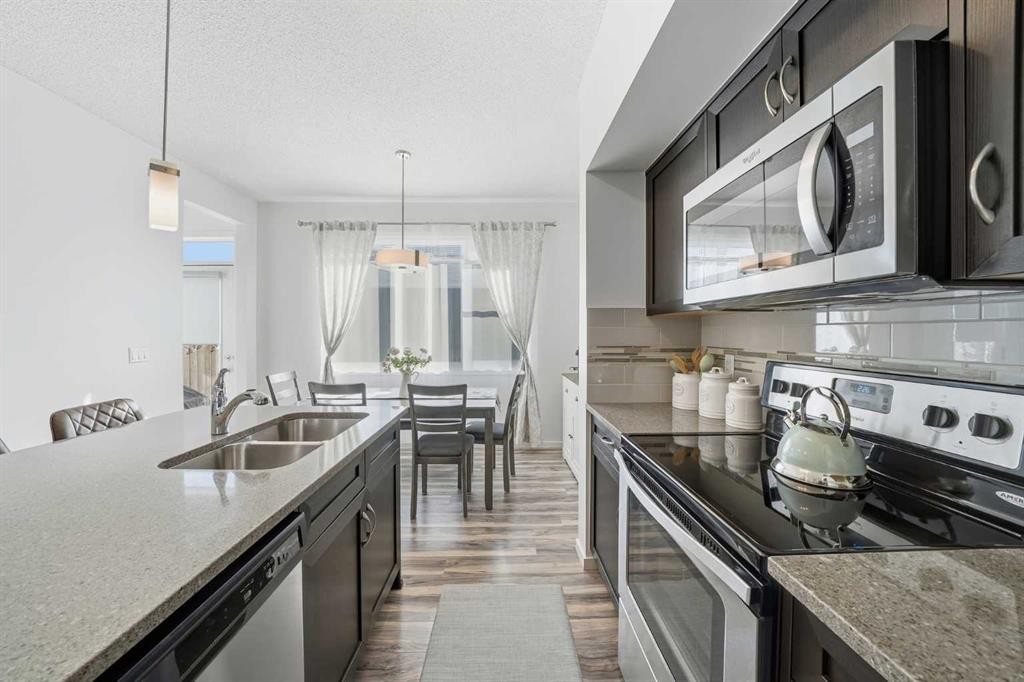 189 Mahogany Drive, Calgary, AB - Indoor Photo Showing Kitchen With Stainless Steel Kitchen With Double Sink With Upgraded Kitchen