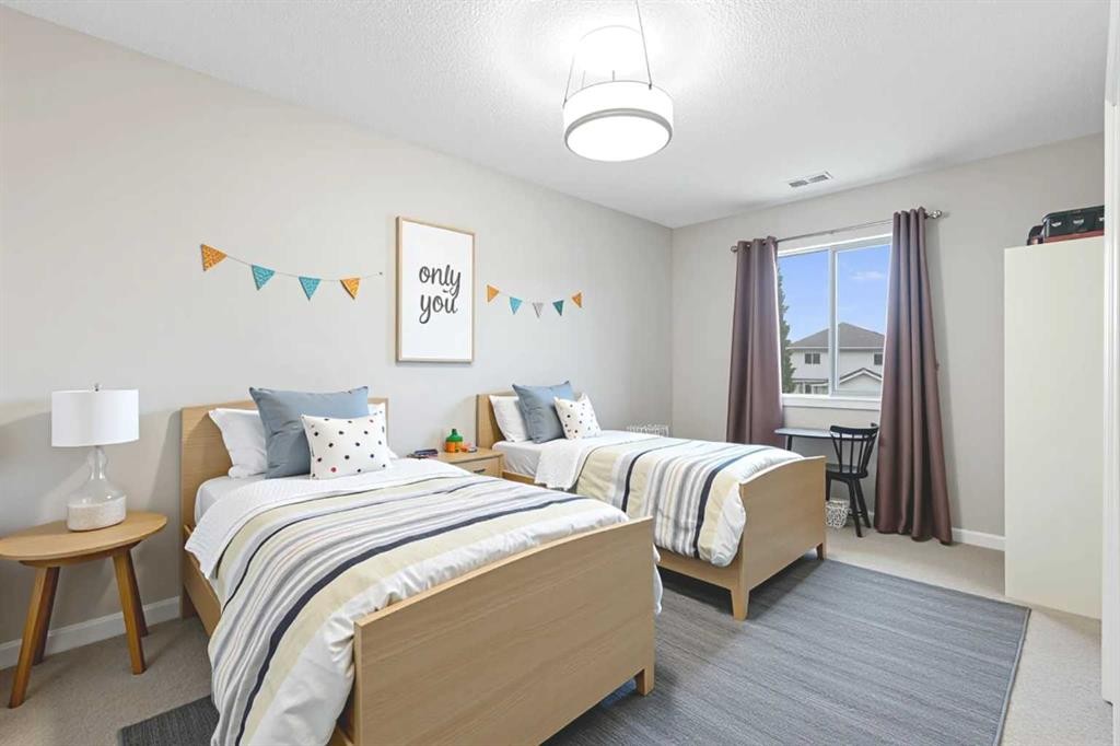221 Prestwick Terrace Se, Calgary, AB - Indoor Photo Showing Bedroom