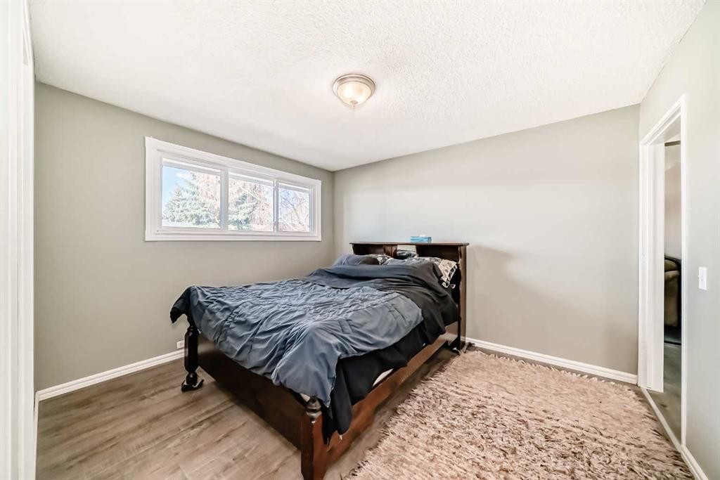 148 Huntridge Road Ne, Calgary, AB - Indoor Photo Showing Bedroom