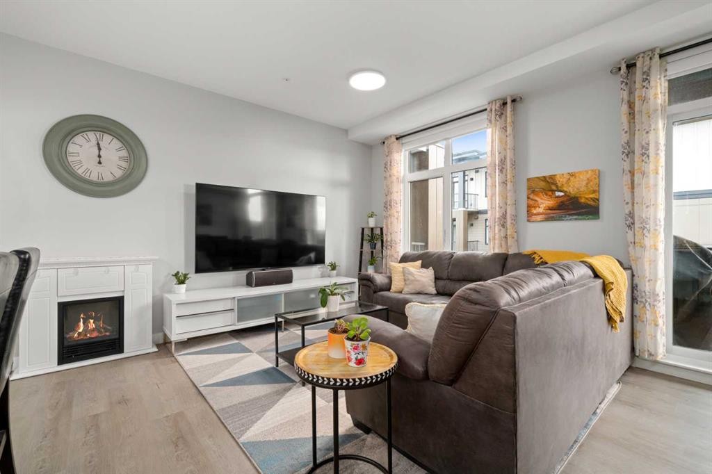 4314-200 Seton Circle Se, Calgary, AB - Indoor Photo Showing Living Room With Fireplace