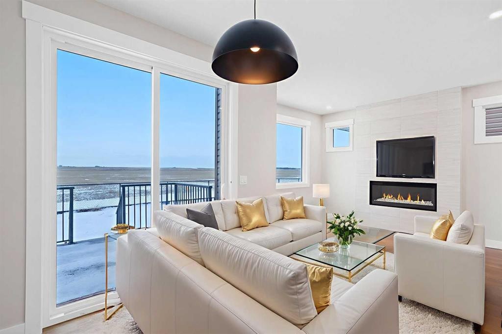 56 Bridges Drive, Langdon, AB - Indoor Photo Showing Living Room With Fireplace