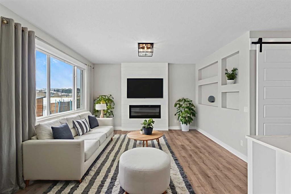 160 Vantage Drive, Cochrane, AB - Indoor Photo Showing Living Room With Fireplace