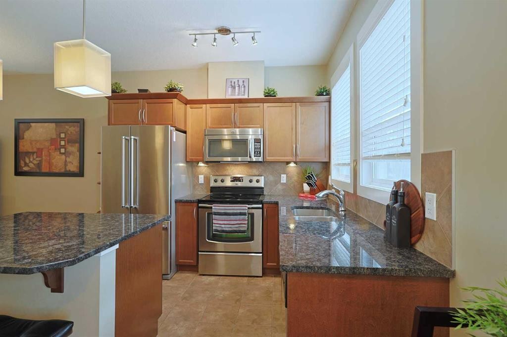 505 Evanston Square Nw, Calgary, AB - Indoor Photo Showing Kitchen With Stainless Steel Kitchen With Double Sink