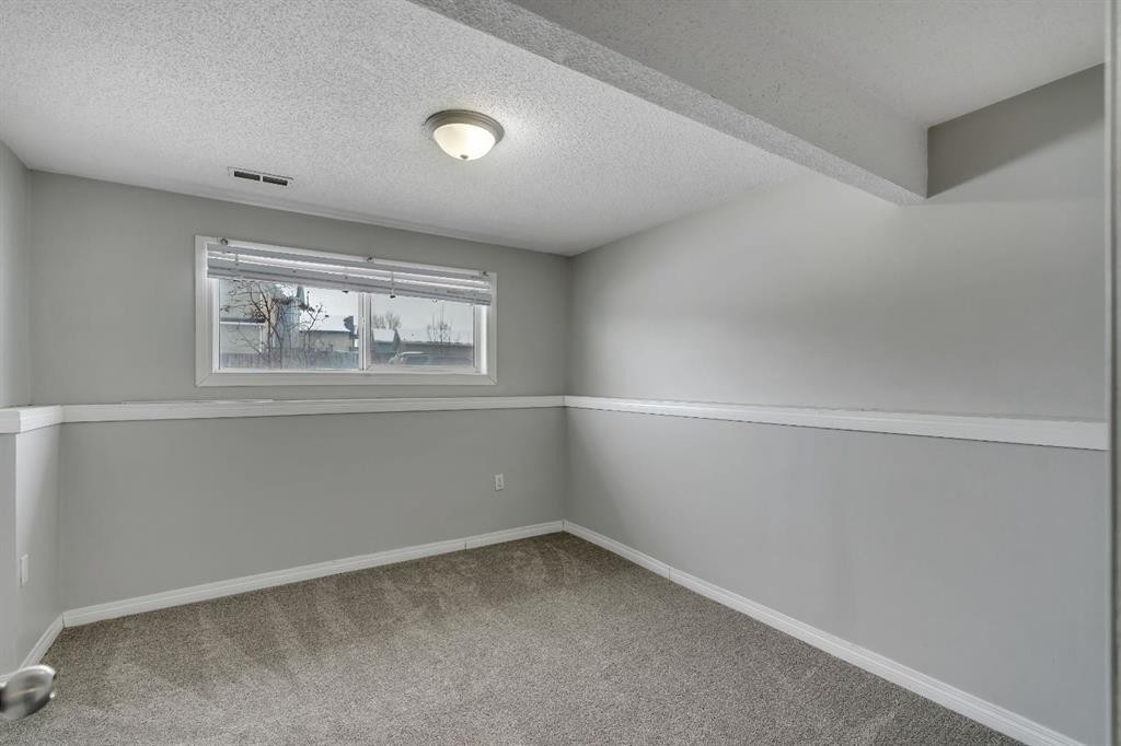 41 Saddlefield Drive Ne, Calgary, AB - Indoor Photo Showing Other Room