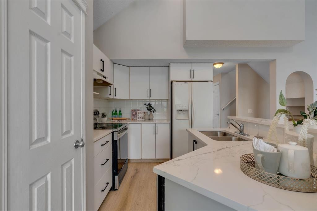 41 Saddlefield Drive Ne, Calgary, AB - Indoor Photo Showing Kitchen With Double Sink With Upgraded Kitchen