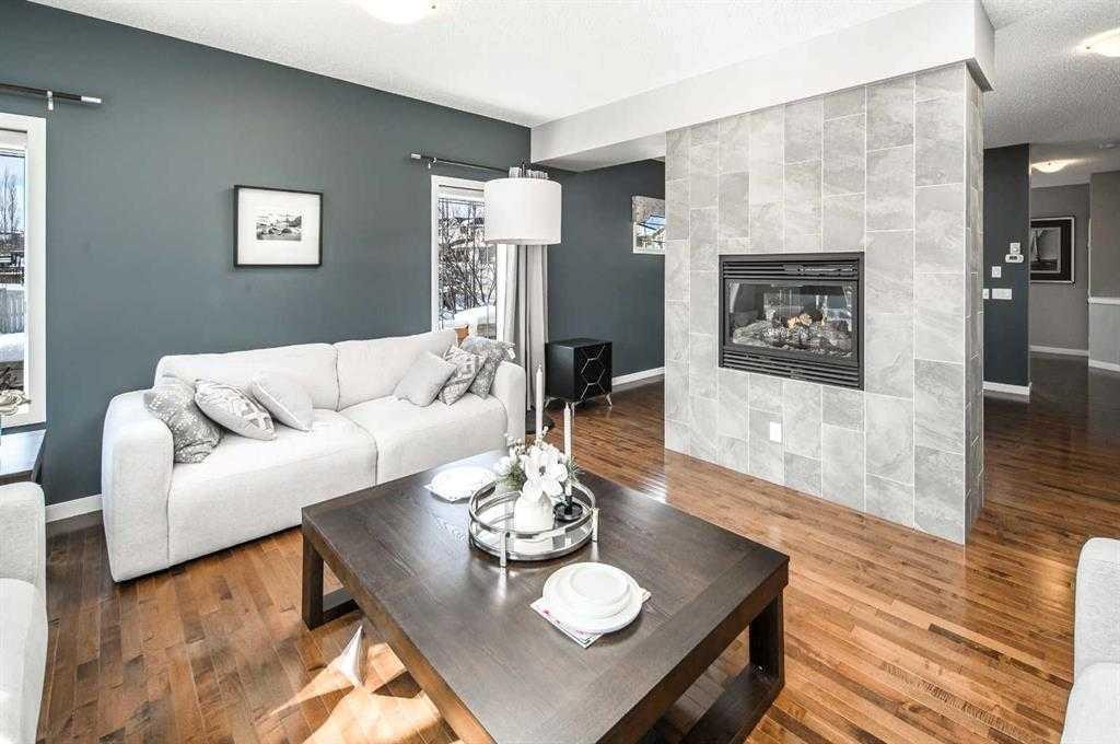 5 Panatella Square Nw, Calgary, AB - Indoor Photo Showing Living Room With Fireplace