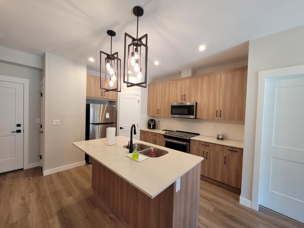 3110-200 Seton Circle Se, Calgary, AB - Indoor Photo Showing Kitchen With Double Sink