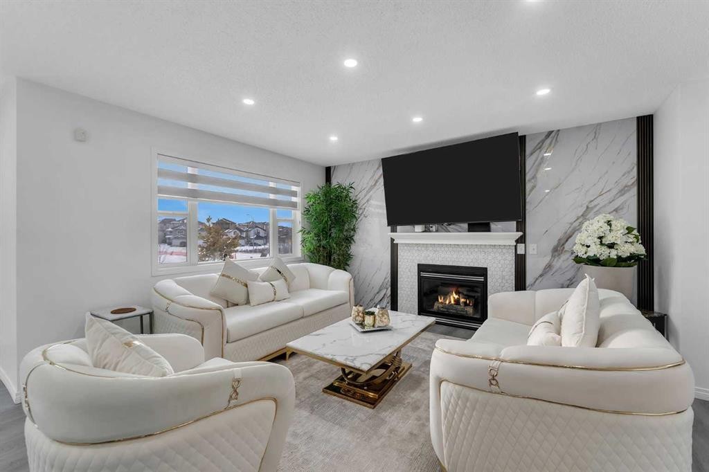 41 Royal Birch Terrace Nw, Calgary, AB - Indoor Photo Showing Living Room With Fireplace