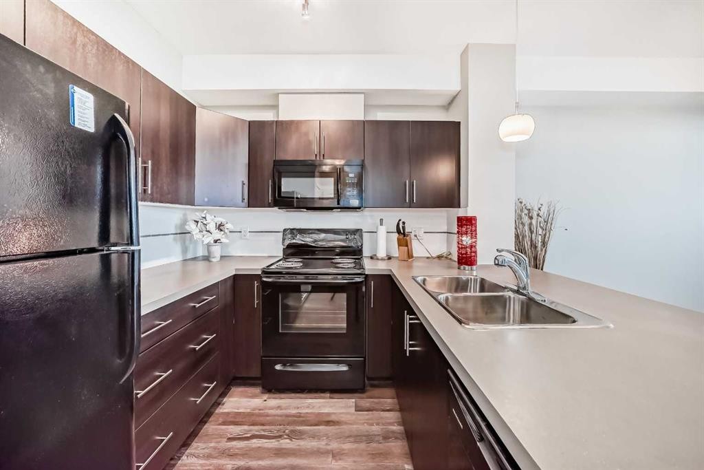 405-2300 Evanston Square, Calgary, AB - Indoor Photo Showing Kitchen With Double Sink