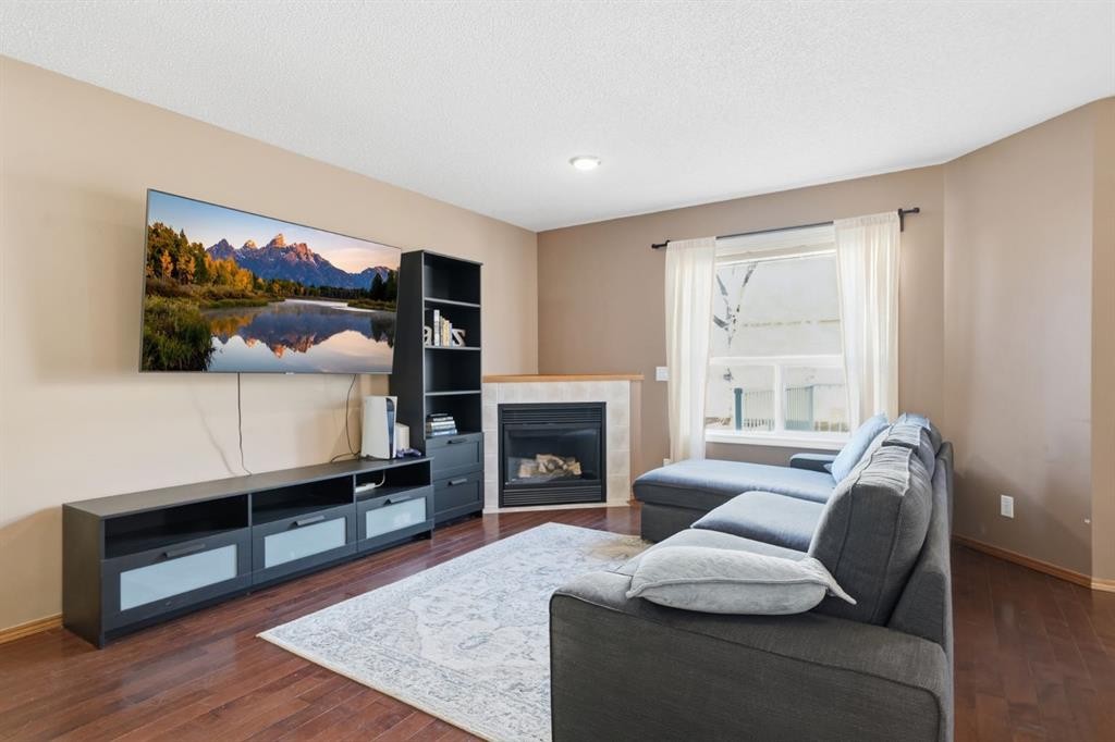 94 Mt Aberdeen Manor Se, Calgary, AB - Indoor Photo Showing Living Room With Fireplace