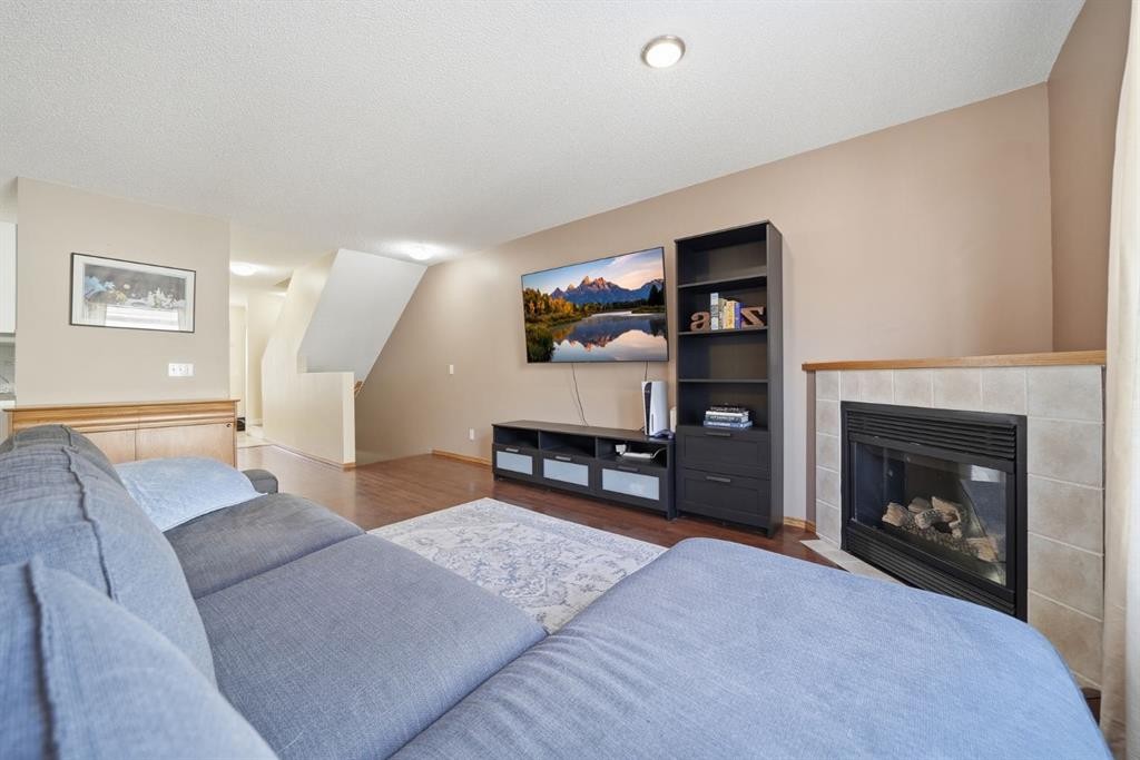 94 Mt Aberdeen Manor Se, Calgary, AB - Indoor Photo Showing Living Room With Fireplace