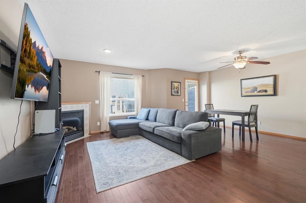 94 Mt Aberdeen Manor Se, Calgary, AB - Indoor Photo Showing Living Room With Fireplace