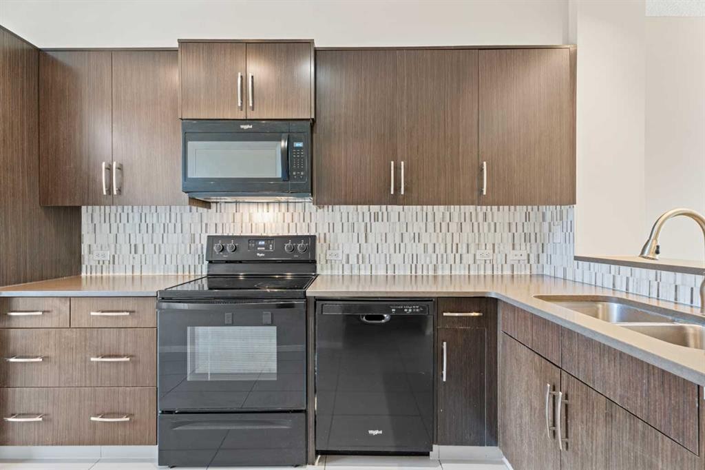 306 Ascot Circle Sw, Calgary, AB - Indoor Photo Showing Kitchen With Double Sink