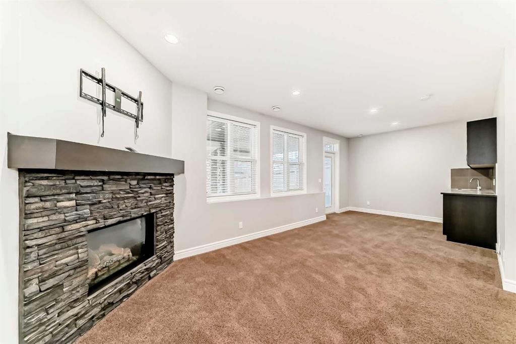 7904 Masters Boulevard Se, Calgary, AB - Indoor With Fireplace