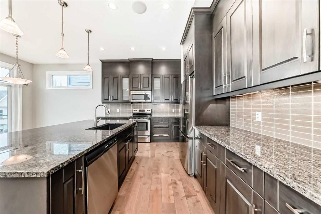 7904 Masters Boulevard Se, Calgary, AB - Indoor Photo Showing Kitchen With Upgraded Kitchen