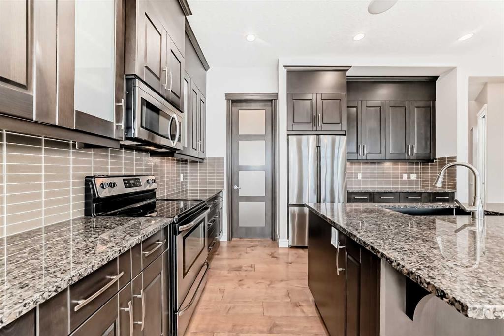 7904 Masters Boulevard Se, Calgary, AB - Indoor Photo Showing Kitchen With Upgraded Kitchen