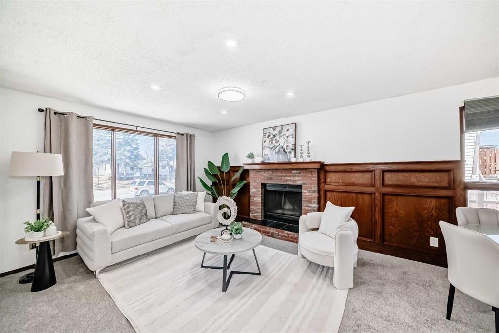 6735 Temple Drive Ne, Calgary, AB - Indoor Photo Showing Living Room With Fireplace