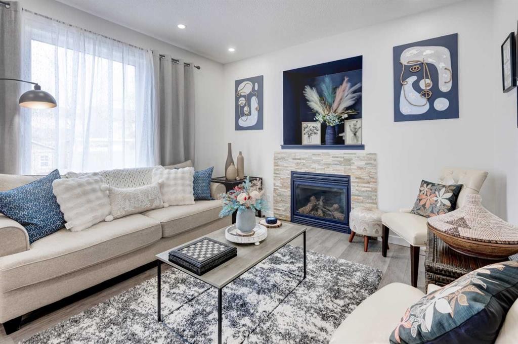 52 Bridlemeadows Common Sw, Calgary, AB - Indoor Photo Showing Living Room With Fireplace