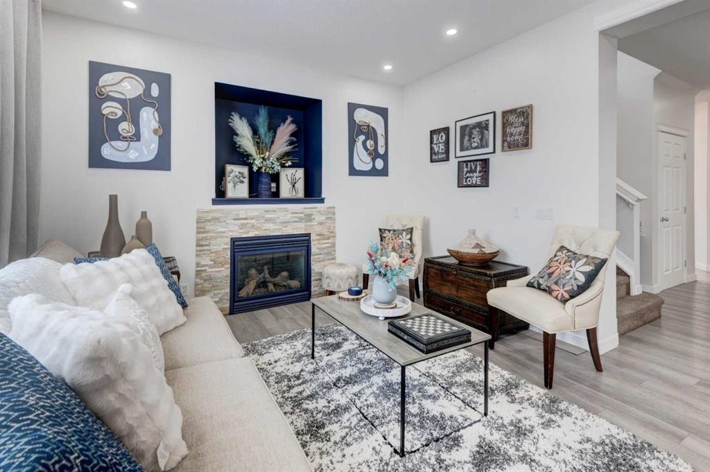 52 Bridlemeadows Common Sw, Calgary, AB - Indoor Photo Showing Living Room With Fireplace