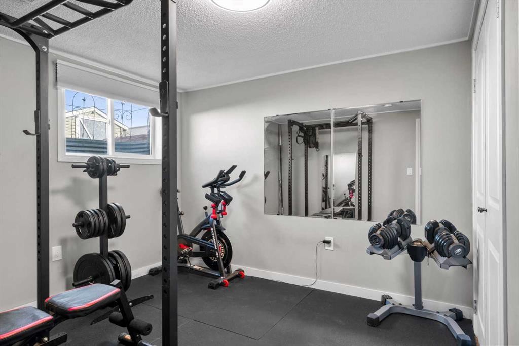 6112 Buckthorn Road Nw, Calgary, AB - Indoor Photo Showing Gym Room