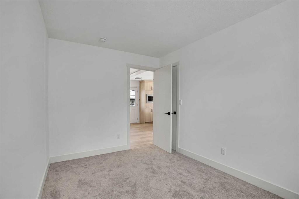 908 Stonehaven Road Sw, Calgary, AB - Indoor Photo Showing Other Room