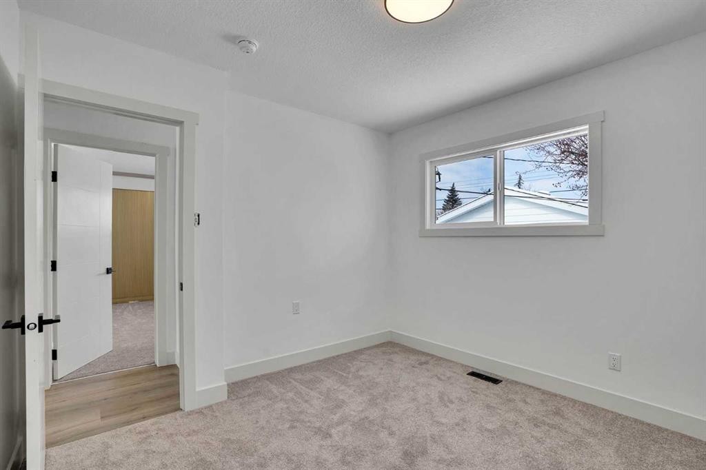 908 Stonehaven Road Sw, Calgary, AB - Indoor Photo Showing Other Room
