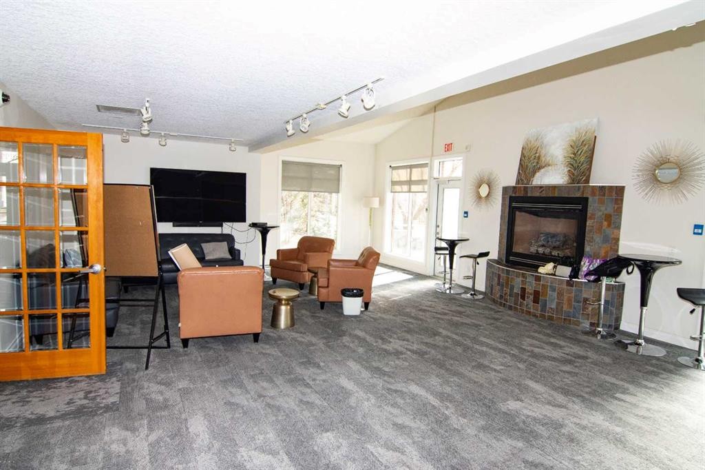 208-10 Hemlock Crescent Sw, Calgary, AB - Indoor With Fireplace