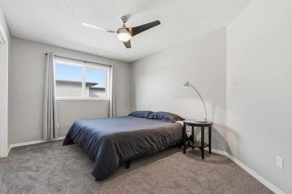 283 Springmere Link, Chestermere, AB - Indoor Photo Showing Bedroom