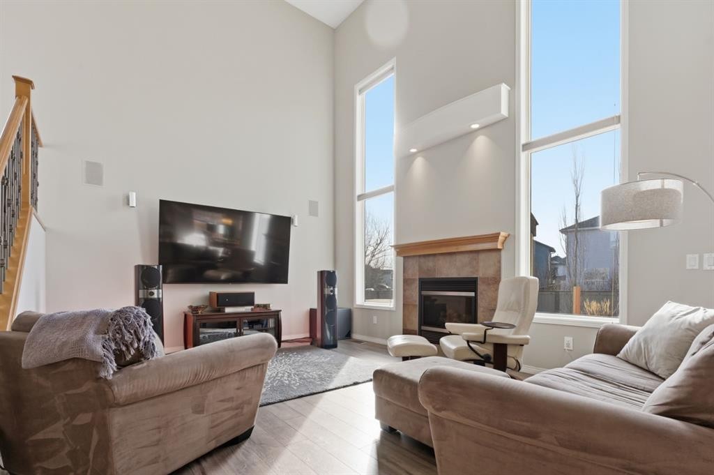 283 Springmere Link, Chestermere, AB - Indoor Photo Showing Living Room With Fireplace