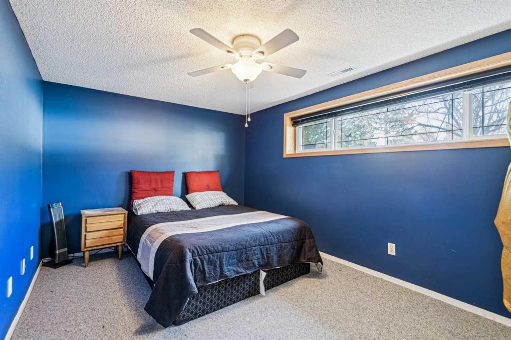 443 Brookmere Crescent Sw, Calgary, AB - Indoor Photo Showing Bedroom