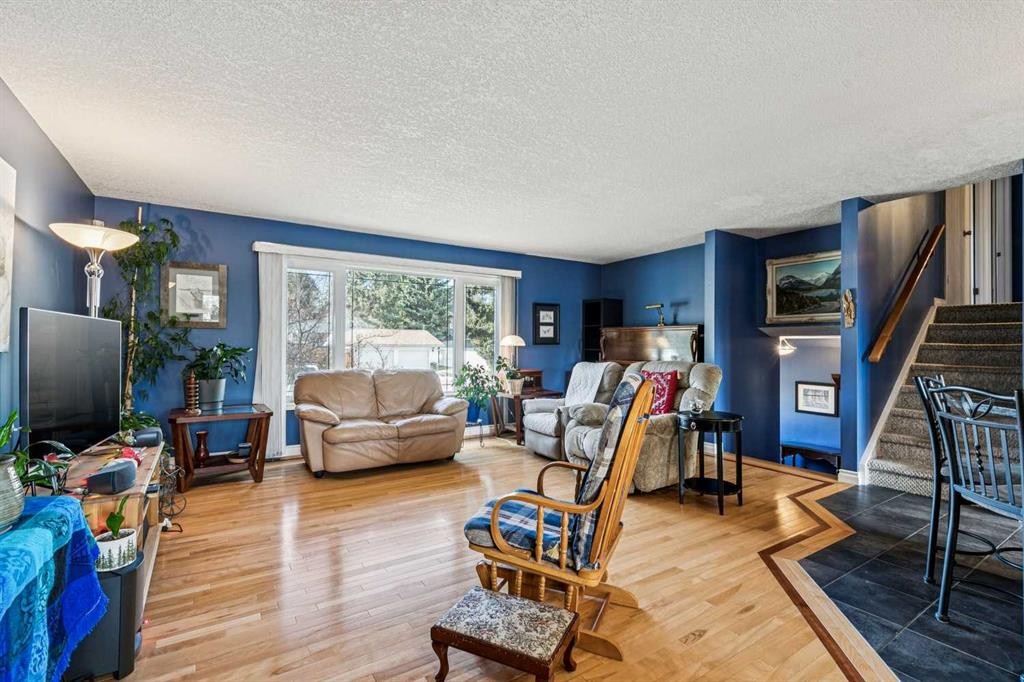 443 Brookmere Crescent Sw, Calgary, AB - Indoor Photo Showing Living Room