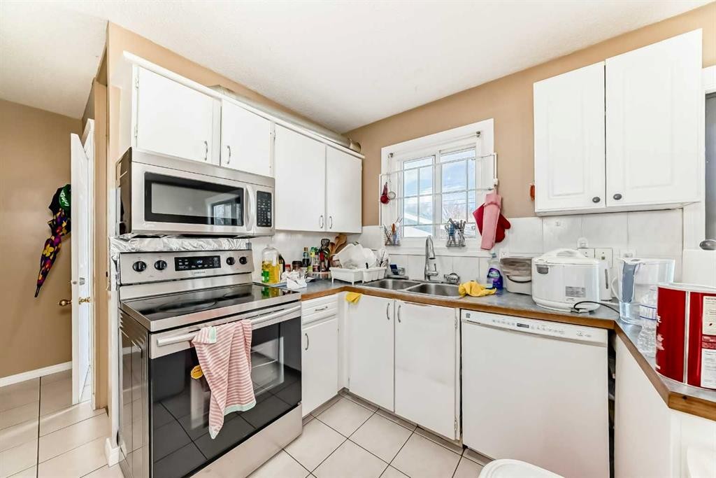 659 Maryvale Way Ne, Calgary, AB - Indoor Photo Showing Kitchen With Double Sink