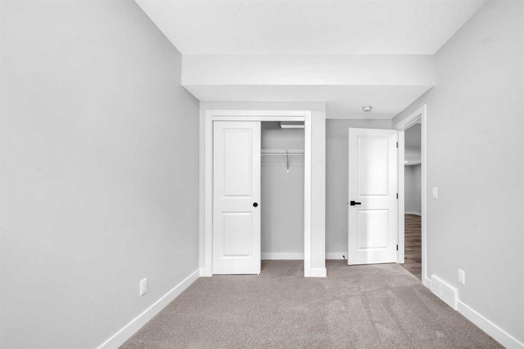 55 Amblehurst Link Nw, Calgary, AB - Indoor Photo Showing Other Room