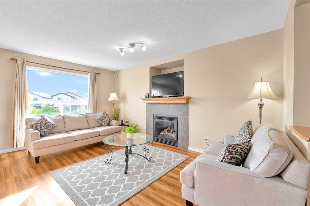 320 Evermeadow Road Sw, Calgary, AB - Indoor Photo Showing Living Room With Fireplace