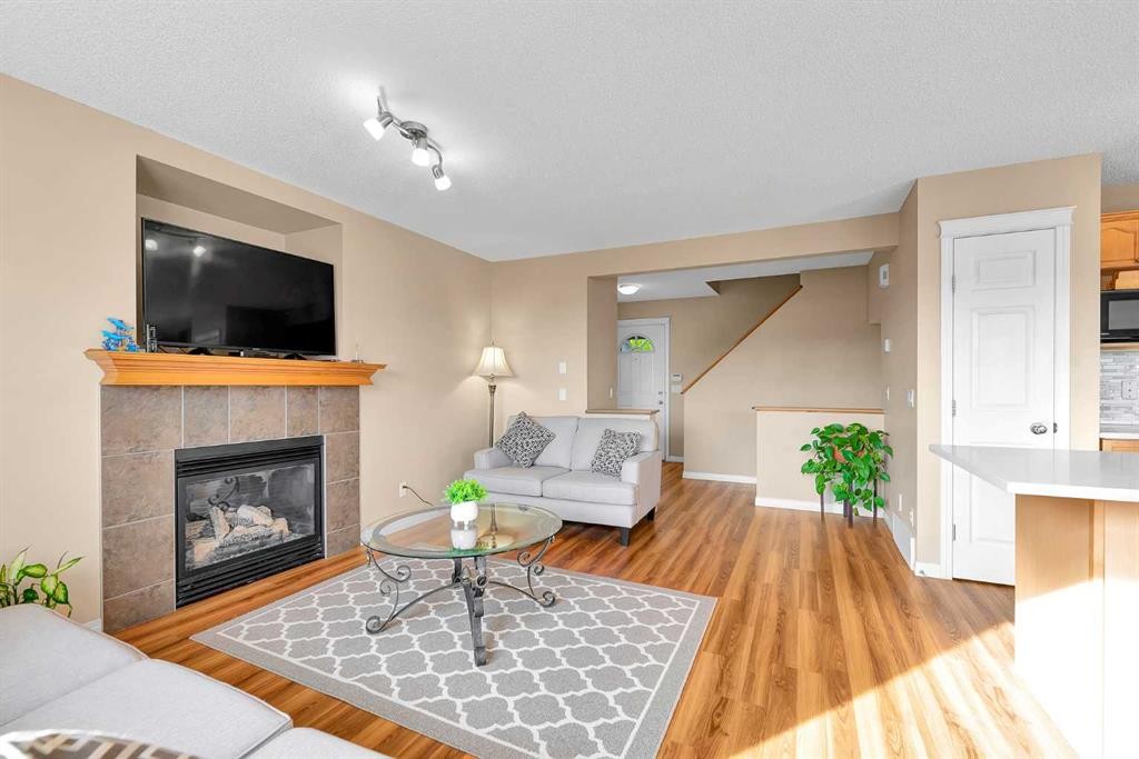 320 Evermeadow Road Sw, Calgary, AB - Indoor Photo Showing Living Room With Fireplace