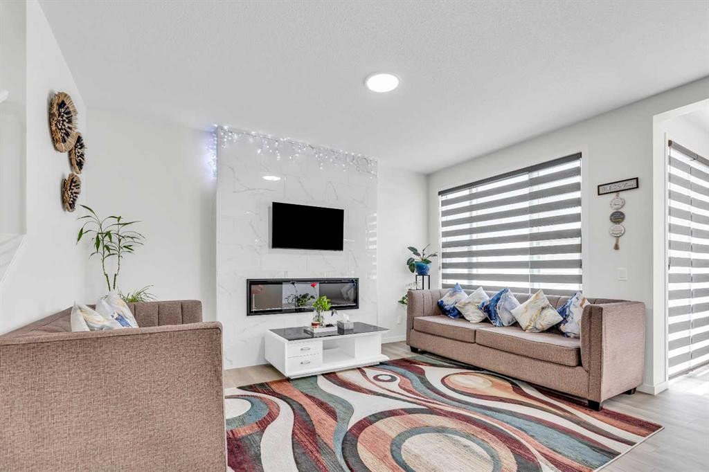 312 Edith Place Nw, Calgary, AB - Indoor Photo Showing Living Room With Fireplace