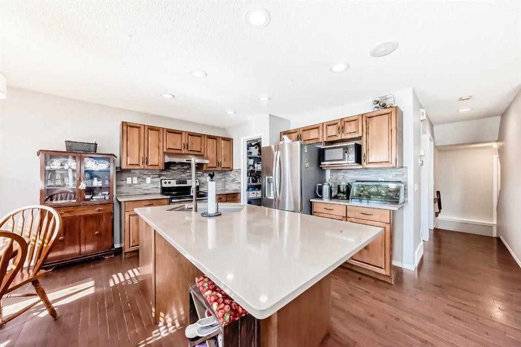 377 Cimarron Boulevard, Okotoks, AB - Indoor Photo Showing Kitchen With Double Sink