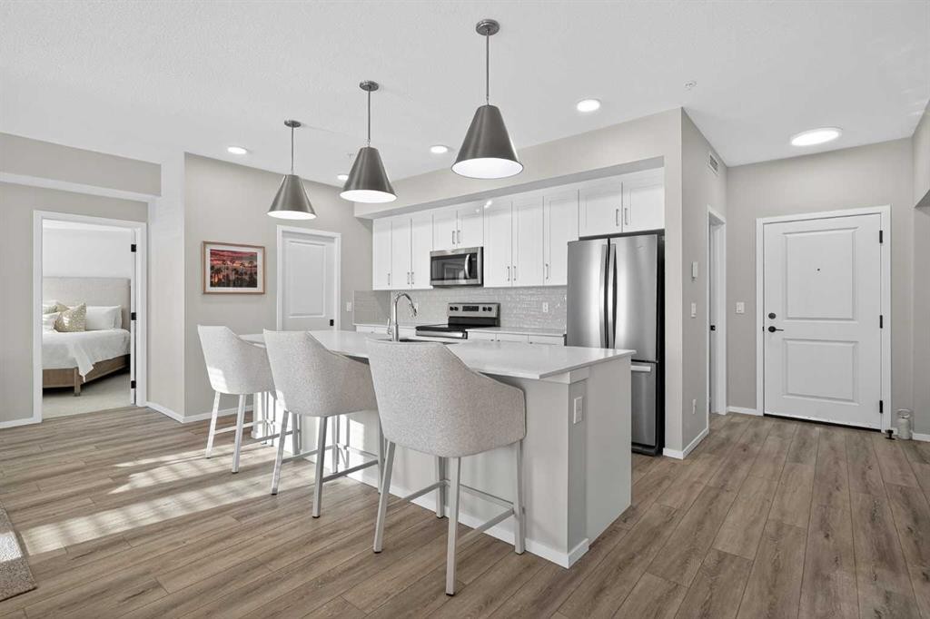 214-140 Mahogany Street Se, Calgary, AB - Indoor Photo Showing Kitchen With Stainless Steel Kitchen With Upgraded Kitchen