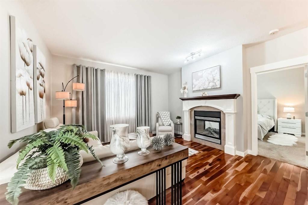 160 Sienna Passage, Chestermere, AB - Indoor Photo Showing Living Room With Fireplace